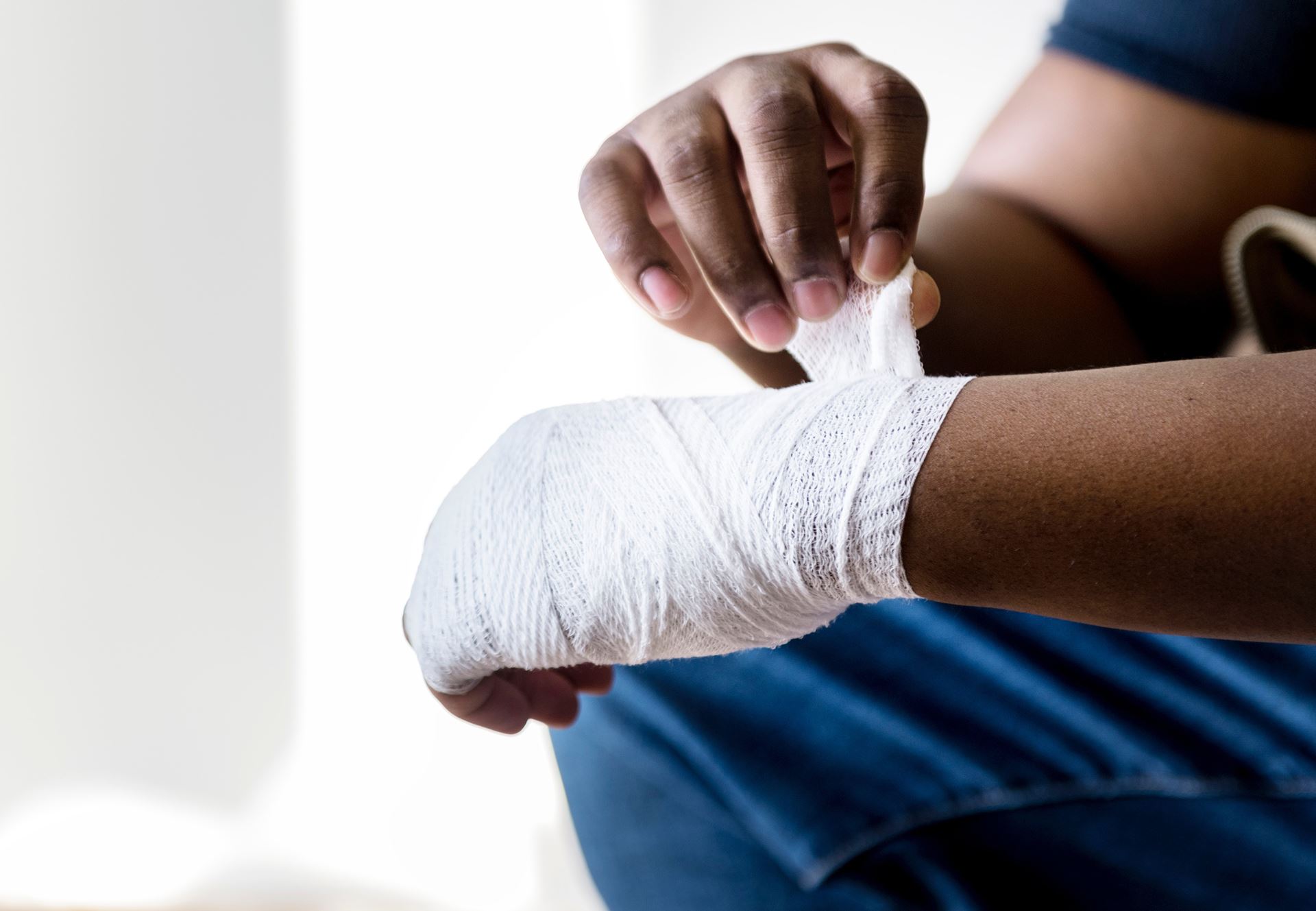 a close up of a bandaged hand